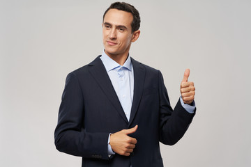 businessman showing thumbs up