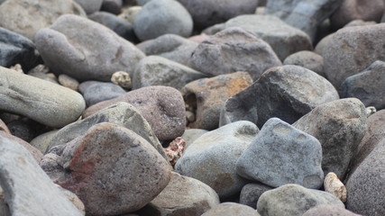 rocks in the beach with sand