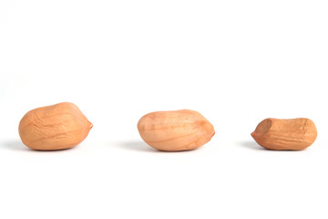 Closeup raw peanuts isolated on white background