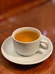 green tea in  cup on wooden background