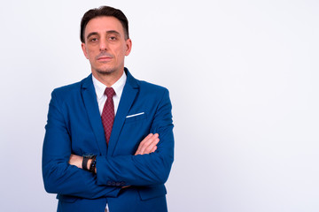 Mature handsome Italian businessman against white background