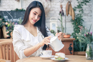 asian women drinking tea and cake