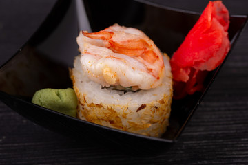Assorty of sushi and roll, serve with red ginger and wasabi sauce