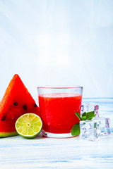 Glass of watermelon juice, lime, mint and ice