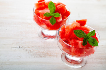 Pieces of watermelon with ice and mint