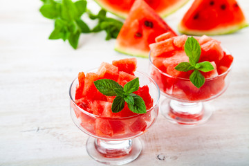 Pieces of watermelon with ice and mint