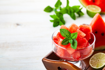 Pieces of watermelon with ice and mint