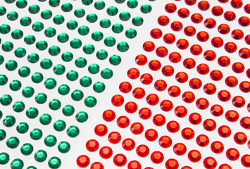 A background of red and green bubbles arranged in equal rows