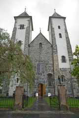 Fototapeta na wymiar Mariakirken, St. Mary's Church, in Sandviken, Bergen, Norway. Front of the church showing the two bell towers