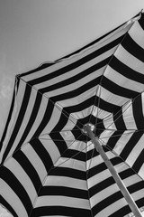 Close-up (high angle) of parasol with black and white stripes as symbol for vacation or abstract © AventuraSur