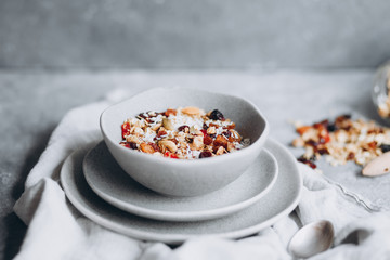 muesli with berries,granola with milk in a plate