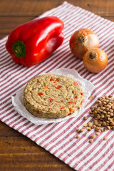 raw vegetarian burger with ingredients