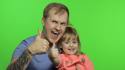 Father and little daughter together looking to camera. Chroma Key. Fathers day