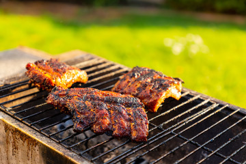 Crispy spare ribs on the grill in the garden