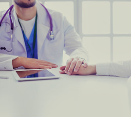 male doctor comforting patient who is in ambulance