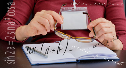 21st century teacher,  concept  online learning  - algebra and geometry, formulas , female hand...