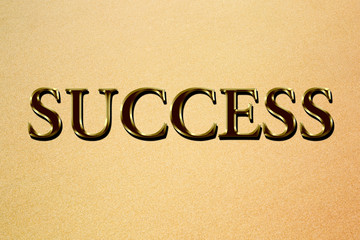 Success phrase on a sand background.
