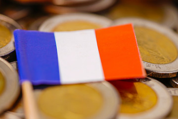 France Flag on coins background : Business and finance concept.