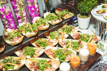 Small plates with appetizer, salad for guests of the event and celebration.