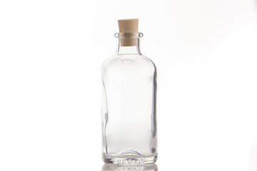 Beautiful transparent bottle with  cap isolated on white background