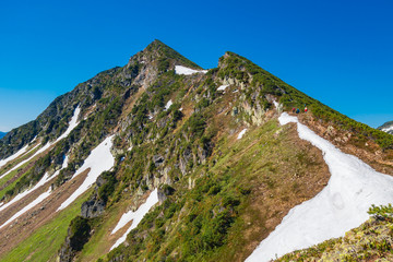 Taltsinsky peak. Mountain view and clear blue sky. Bright sunny day in the mountains.