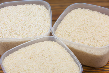 Raw rice groats for risotto on  plate