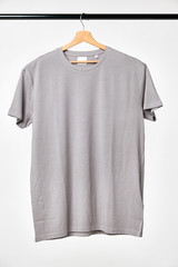 Blank gray T-Shirt Mock-up hanging on white background.