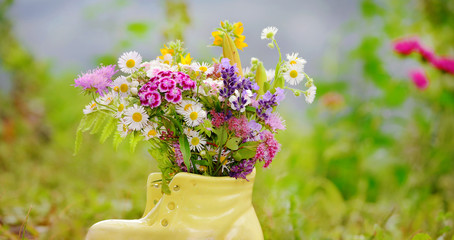 Beautiful Wild Spring Flowers  in a Small Yellow Shoe  Vase 