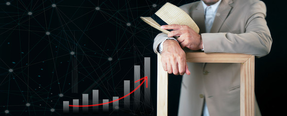  Young CEO business man in suit on black background.