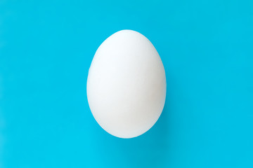 Easter egg on colorful bright blue background