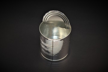 Top view of open empty tin can. Closeup photo isolated on black background