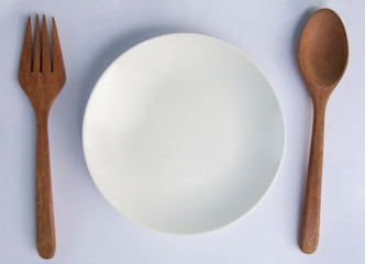 Spoon and Fork and disk on white background