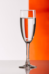 Three glasses of wine against colorful background