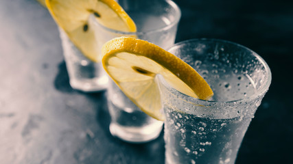 Tequila, vodka, gin. Alcohol in glasses. Chilled alcoholic drink misted takan