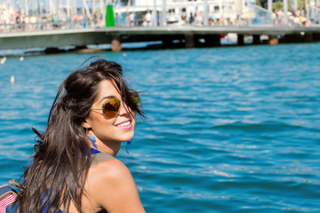 Portrait of Beautiful Happy Woman on a Sea Background in Barcelona,Spain 