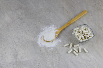 Fermented and canned vegetables in jars of spices on a wooden background