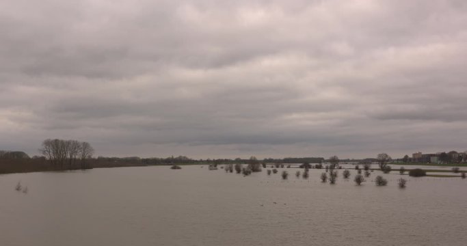 flooded fluvial landscape of the river IJssel due to heavy rainfall in Europe. The ancillary channel, dug for water storage in case of a flood, is inundated. DEVENTER, THE NETHERLANDS - FEBRUARY 2020