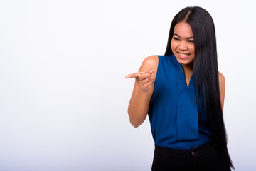 Portrait of happy young Asian businesswoman laughing