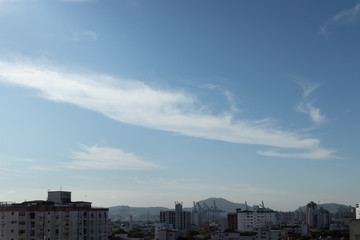 Fototapeta na wymiar blue sky with clouds over the city