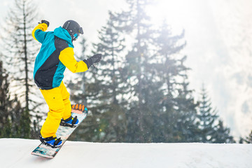 Snowboarder during a trick on a slope