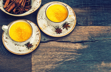 Hot turmeric curcuma milk drink spices Vintage toned picture