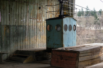 Old rusty blue cable car hondola at the station in Chiatura