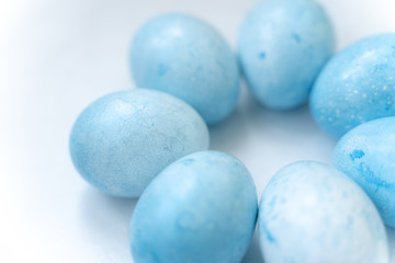 Easter colored egg on a light background background.