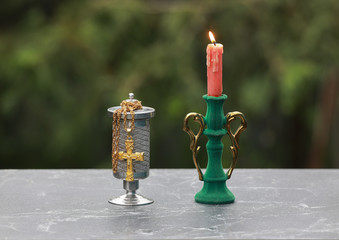  metal urn with ashes of dead person on funeral,  Sad grieving moment at end of life. 