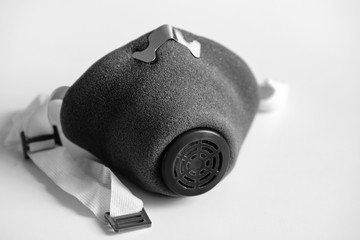 Black and white photo. A respirator is a means of individual respiratory protection during an...