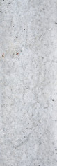 Fototapeta premium An old concrete surface with traces of destruction exposed stones interspersed