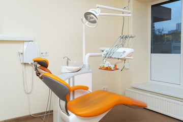 Interior stylish modern dentist office in orange style.
