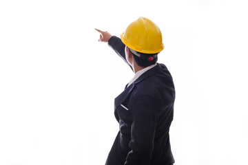 Rear view of young man engineer wearing protective helmet pointing finger up like pressing an imaginative button isolated over white background.