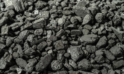 Anthracite is the best type of hard coal. Panoramic background from pieces of anthracite. Selective focus.