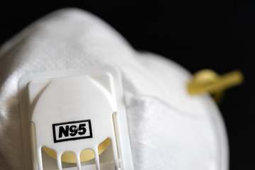 Protective masks on black background. N95 masks on a black background. Medical and construction protective equipment. N95 masks M3